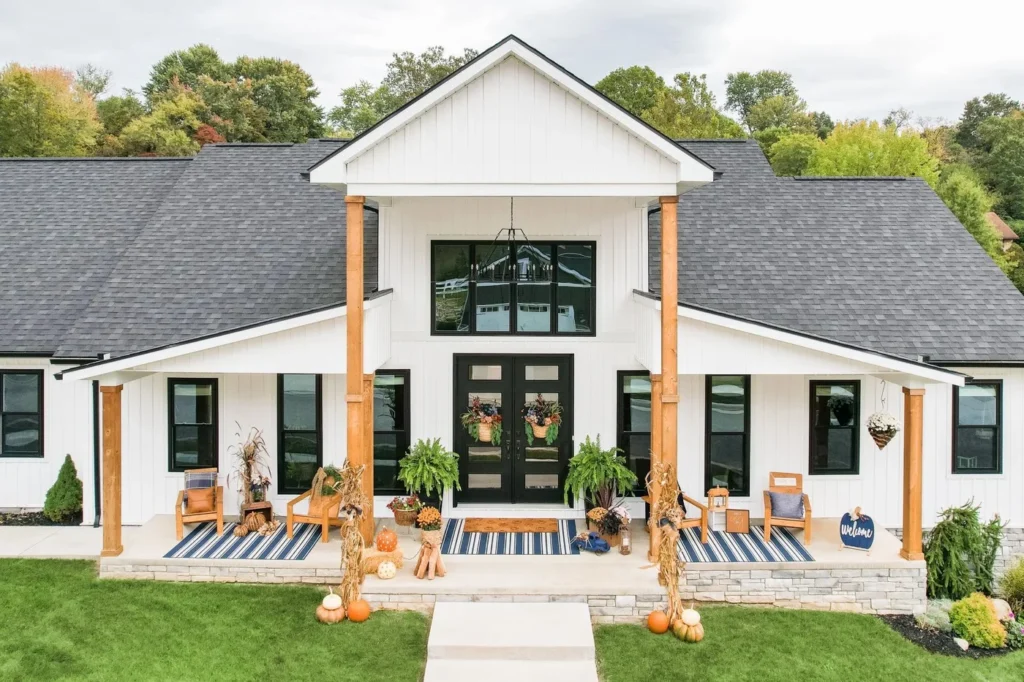 full home exterior of home remodeling project with white siding and now windows in Richmond Virginia