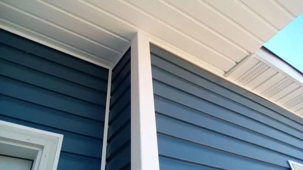 trim and soffit with fascia under roof view with blue siding