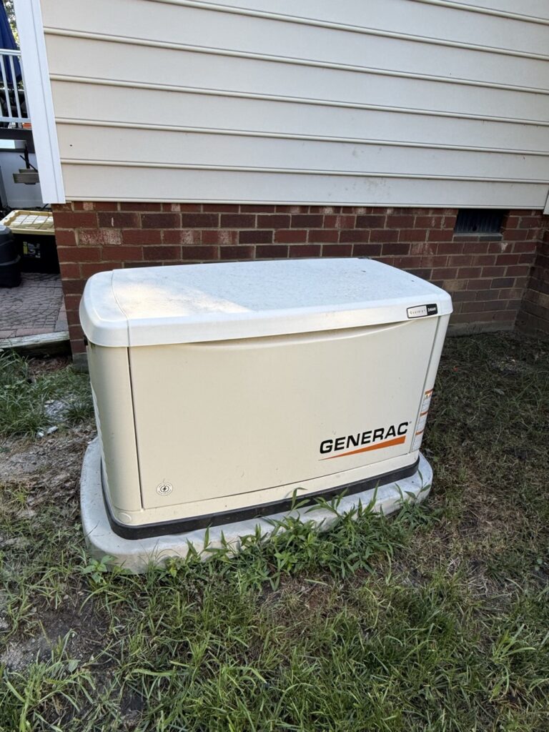Generac Guardian home standby generator installed on a pad beside a Richmond-area home