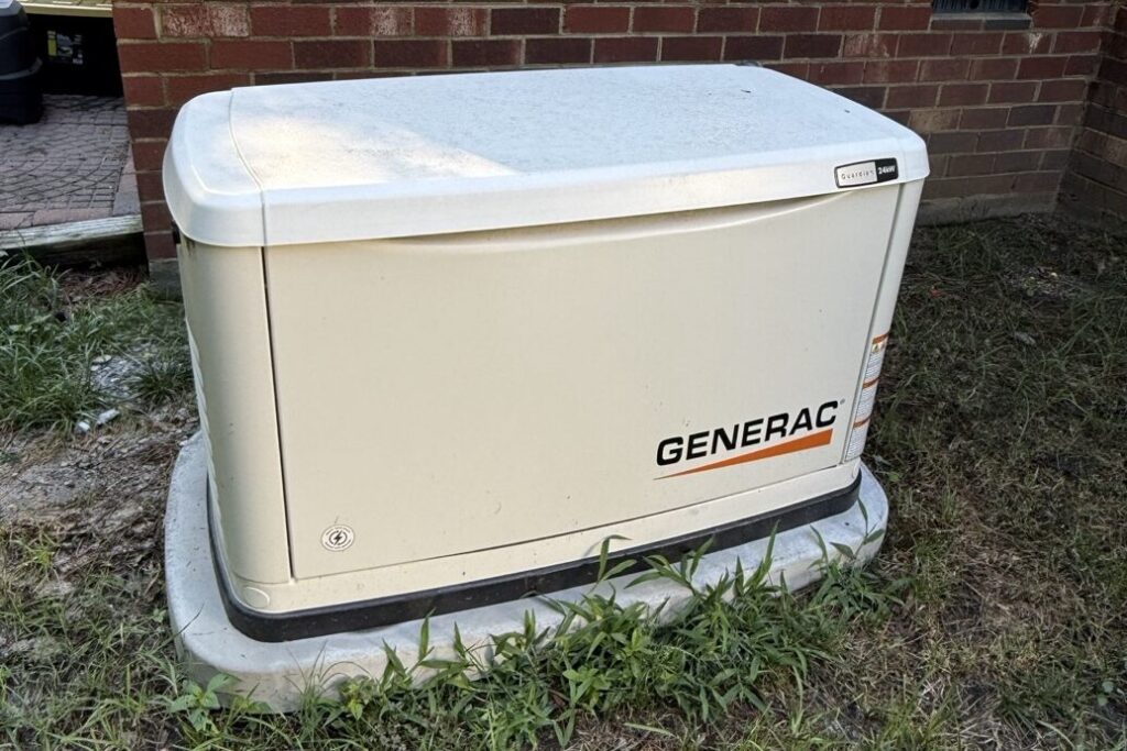 Generac Guardian home standby generator installed on a pad beside a Richmond-area home