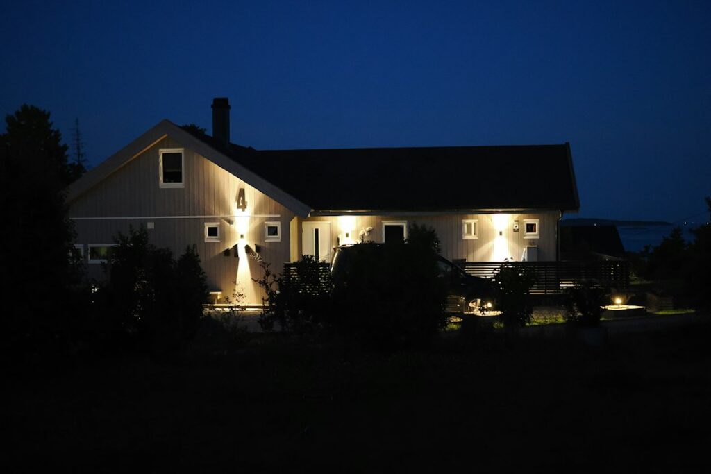 Home with lights on at night